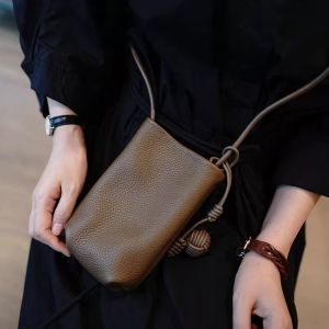 With literary and artistic small fresh small round ball pendant super hot crossbody mobile phone bag soft leather cute mini sm