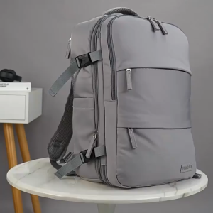 Grey Expandable Carry-On Backpack with Multiple Compartments and Straps. Expandable design for travel. Grey color.