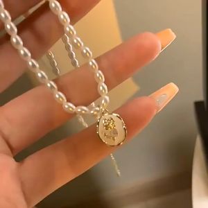 Nicedays🍒Kalung Mutiara Antik Gaya Prancis Rantai Klavikula Desain Akal Canggih Kalung Panjang Wanita Liontin Mawar COD