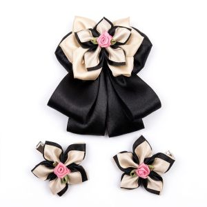 Purple satin flower hair accessories with detachable tail clips.