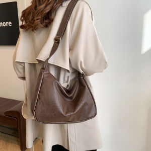 กระเป๋าสะพายข้างหนังนิ่มสไตล์มอเตอร์ไซค์สำหรับผู้หญิง กระเป๋าทรงกลมขนาดใหญ่สำหรับเดินทาง กระเป๋าสะพายข้างแบบสะพายข้าง กระเป๋าสะพายข้างหนัง PU ทรงม้า