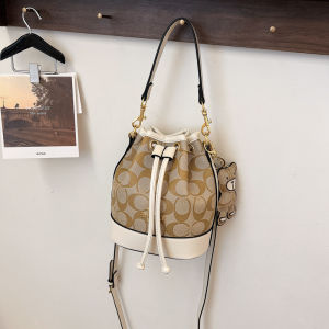 Women Vintage Monogram Mini Bucket Bag Drawstring Crossbody Purse with Bear Charm PU Leather Trim Top Handle Shoulder Bag