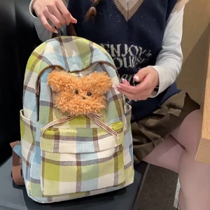 SEA YADOU กระเป๋าเป้ลายสก๊อตรุ่นใหม่ของเกาหลีสไตล์วิทยาลัยสดใสพร้อมจี้ตุ๊กตาหมี