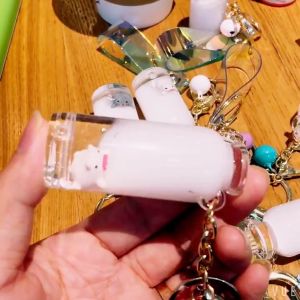 Creative Floating Pig Milk Pig Keychain Cartoon Oil Filling Drifting Bottle Car Keybag Pendant