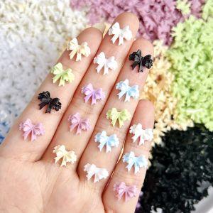 20 ชิ้น/ถุงใหม่สีชมพูสีขาวริบบิ้นโบว์เล็บ Charms เกาหลีสีชิ้นส่วนเรซิ่น 3D เล็บ Art Tie ตกแต่ง Kawaii อุปกรณ์เสริม