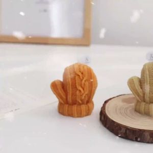 Woolen gloves candles holiday gifts photography props DIY creative ornaments aromatherapy candles Christmas with hands