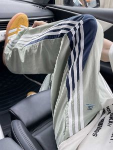 กางเกงลำลองชายผ้าไหมน้ำแข็งแห้งเร็ว ทรงหลวม ทรงสปอร์ต ฤดูร้อน กางเกงขายาวลำลอง ทรงยาว ทรงหลวม กางเกงขายาวลายทาง