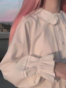 เสื้อเชิ้ตคอปกตุ๊กตาแขนยาวสีขาวสำหรับนักเรียนผู้หญิง เสื้อชั้นในสไตล์เกาหลี ทรงหลวม แขนยาว ทรงเข้ารูป แฟชั่นฤดูใบไม้ผลิ