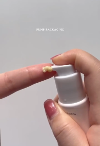 CROWNNA 24K Gold Brightening Cream 0-5 key attributes: 24K gold brightening skin care tube packaging pink design. 0-2 scene: skincare routine beauty product display.