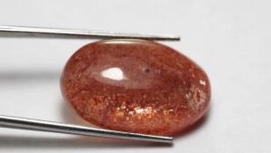 17.85 ct พลอยดิบ ซันสโตน (Sun Stone) ทรงไข่หลังเบี้ย สีแดง ส้ม แอฟริกา