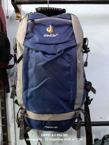 Deuter Jupiter 60L backpack with free rain cover multiple compartments adjustable straps durable material suitable for hiking and travel.