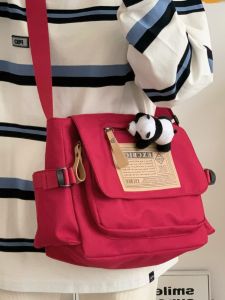 กระเป๋าสะพายข้างผ้าใบความจุขนาดใหญ่สําหรับผู้หญิง 2023 สไตล์ญี่ปุ่น Casual Retro Messenger กระเป๋าที่สมบูรณ์แบบสําหรับนักเรียน