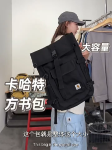 Carhartt Black Roll-Top Backpack with Buckle Closure and Multiple Pockets for Urban Use