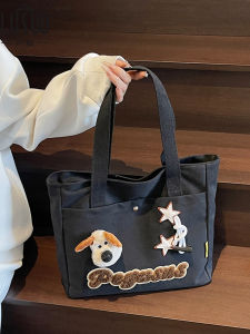 กระเป๋าผ้าใบเดนิมทรงโต้คลื่นสำหรับนักเรียนนักศึกษาผู้หญิงที่ทนทานและทำความสะอาดง่าย กระเป๋าสะพายไหล่แบบลำลองสำหรับใส่หนังสือและอุปกรณ์เรียน