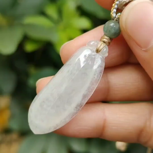 Icy Translucent Natural Burmese Jadeite Jade Crafted as Fuku Melon Pendant with light green hue certificate weighs 4.82 grams measurement 36.9 * 13.8 * 5.6 mm (pendant316)