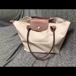 Foldable single-shoulder bag lightweight and large-capacity travel bag fashionable student bag short-handle dumpling-shaped bag commuting tote bag