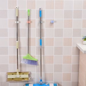 ที่แขวนอเนกประสงค์ ที่หนีบไม้กวาด ไม้ถู ติดผนัง ไม่ต้องเจาะ (สุ่มสี)