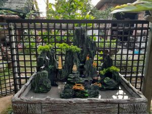 Hòn non bộ ngang 65cm rộng 30cm cao 47cm tặng kèm máy bơm