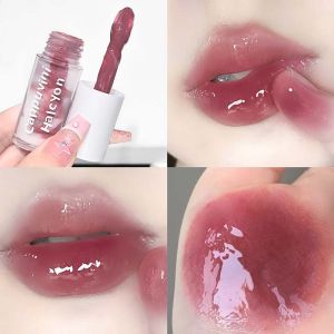 ลิปกลอสสองสีใสคริสตัล ริมฝีปากอวบอิ่มเรียบเนียน ใช้งานง่าย ติดทนนาน ให้ความชุ่มชื้น ลิปกลอสแต่งหน้า