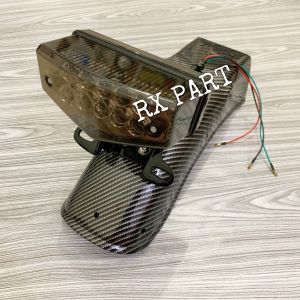 Slebor/spakbor belakang rx king karbon+stop led  mika riben+dudukan stop dan nomor polisi  Barang sesuai dengan yg ada di foto