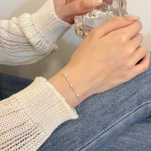 GLAMOR✨ Elegant Twist & Shine Silver Bracelet with Cubic Zirconia Accents