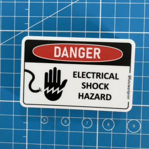 Danger Electrical Shock Hazard. High Voltage Electric. Wire Cable Hand. Sticker Sign Warning Caution Label Elektrik
