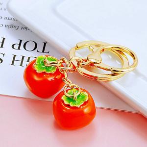 พวงกุญแจรถยนต์ลูกพลับนําโชคลาภคู่กับลูกพลับที่ห้อยกระเป๋าน่ารักสําหรับผู้หญิงห่วงโซ่กุญแจของขวัญเล็กๆสําหรับงานเลี้ยงประจําปี