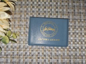 Drivers License Holder (Cowhide Material Hardbound) - Multiple Colors - Gold Embossed Text - Durable Material - Compact Size - Ideal for Travel