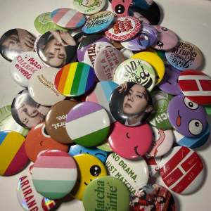 Assorted 32mm Button Pins Set of 10pcs with diverse designs and colors for school and office use.