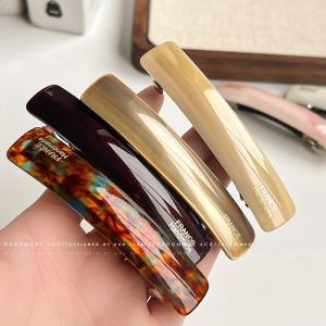 กิ๊บติดผมแบบมีด้ามจับทรงไขว้สำหรับผู้หญิง กิ๊บติดผมแบบหางม้า ประดับผมแบบใหม่ปี 2025 รูปปากเป็ด อุปกรณ์ตกแต่งผมดีไซน์เรียบง่าย