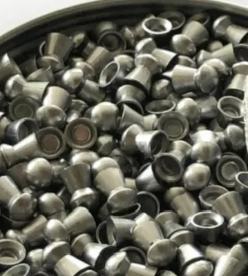 Lead pellets in a container. Round shape smooth surface uniform size Fitting for airarms cal twentytwo .