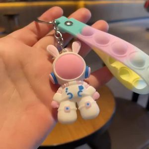 Móc khóa thỏ phi hành gia hoạt hình siêu dễ thương kèm dây Push Pop