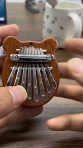8 Key Mini Wooden Kalimba High Quality Exquisite Finger Thumb Piano Marimba Musical Good Accessory Pendant Gift\\n\\n What is a Mini Wooden Kalimba?\\n\\nA mini wooden kalimba, also known as a thumb piano or marimba, is a small musical instrument made from wood and metal keys. It has a unique sound that can be used to play various styles of music, from traditional African melodies to modern pop tunes. This versatile instrument is perfect for beginners and experienced musicians alike.\\n\\n Key Features & Benefits\\n\\nThe 8-key mini wooden kalimba features a compact design, making it easy to carry around and play anywhere. Its high-quality craftsmanship ensures durability and longevity, allowing you to enjoy your musical journey for years to come. Additionally, this exquisite finger piano produces beautiful, soothing sounds that can help reduce stress and promote relaxation.\\n\\n How to Choose the Right Mini Wooden Kalimba\\n\\nWhen selecting a mini wooden kalimba, consider the following factors:\\n\\n- **Size:** Choose a size that suits your playing style and comfort level.\\n- **Material:** Opt for a high-quality marimba made from durable wood and metal keys.\\n- **Sound:** Listen to the instrument's sound before purchasing to ensure it meets your expectations.\\n\\n How to Use Your Mini Wooden Kalimba\\n\\nPlaying the mini wooden kalimba is simple and fun. Follow these steps to get started:\\n\\n1. Hold the instrument securely with one hand.\\n2. Use your thumbs to pluck the metal keys, creating different notes.\\n3. Experiment with various playing techniques to discover new sounds and melodies.\\n\\n Playing Techniques & Tips\\n\\nTo enhance your mini wooden kalimba experience, try these playing techniques and tips:\\n\\n- **Strumming:** Pluck multiple keys simultaneously to create a chord-like sound.\\n- **Glissando:** Slide your thumb along the keys to produce a smooth, sliding effect.\\n- **Rhythmic Patterns:** Develop your own rhythmic patterns to add complexity and interest to your music.\\n\\n Care & Maintenance\\n\\nTo keep your mini wooden kalimba in excellent condition, follow these care and maintenance tips:\\n\\n- Store the instrument in a cool, dry place away from direct sunlight.\\n- Clean the keys regularly with a soft cloth to prevent dust buildup.\\n- Avoid exposing the instrument to extreme temperatures or humidity.\\n\\n Why Choose High-Quality Exquisite Finger Piano?\\n\\nInvesting in a high-quality exquisite finger piano offers numerous benefits, including:\\n\\n- **Superior Sound:** Enjoy rich, resonant tones that enhance your musical experience.\\n- **Durability:** Built to last, these instruments withstand regular use and travel.\\n- **Versatility:** Play various genres of music with ease, from traditional African melodies to modern pop tunes.\\n\\n Comparison with Other Musical Accessories\\n\\nCompared to other musical accessories, the mini wooden kalimba offers a unique combination of portability, affordability, and versatility. While some instruments may offer more complex features, the simplicity and ease of use of the mini wooden kalimba make it an ideal choice for beginners and experienced musicians alike.\\n\\n Gift Ideas for Music Lovers\\n\\nLooking for the perfect gift for a music lover? Consider these ideas:\\n\\n- **Mini Wooden Kalimba:** A beautiful, portable instrument that produces soothing sounds.\\n- **Music Lessons:** Give the gift of learning with private lessons or online courses.\\n- **Sheet Music:** Inspire creativity with sheet music for various genres and skill levels.\\n\\n Conclusion\\n\\nThe 8-key mini wooden kalimba is a high-quality exquisite finger piano marimba musical good accessory pendant gift that offers numerous benefits for musicians of all skill levels. With its compact design, beautiful sound, and ease of use, this versatile instrument is sure to bring joy and relaxation to anyone who plays it. So why wait? Invest in a mini wooden kalimba today and start your musical journey!\"