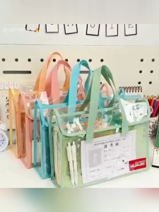 Stock no.169 Transparent File Bag with green handles and mesh body for organizing documents. Suitable for carrying books and stationery. Available in pastel colors.