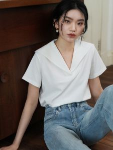 เสื้อยืดคอวีแขนสั้นหลวมสไตล์วินเทจฝรั่งเศสสำหรับผู้หญิงในช่วงฤดูร้อน สีขาว คอวี แขนสั้น ทรงหลวม ผ้าคอตตอนผสม