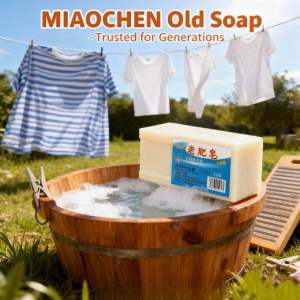 White bar soap with blue label. Wooden tub with soap suds. Clothesline with hanging shirts. Outdoor scene with grass and trees sabun penghilang kotoran kulat bau hitam
