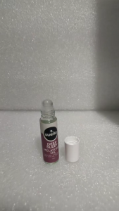 Sueno Deep Sleep Melatonin Oil Roll-On Bottles with White Capsules in Cloudy Sky Background.