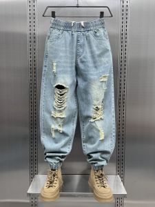 กางเกงยีนส์ทรงหลวมเอวยางยืดสำหรับผู้ชาย ทรงฮาเร็ม ทรงหลวม ทรงลำลอง สไตล์ฤดูใบไม้ผลิและฤดูใบไม้ร่วง