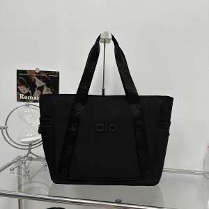 RCW Alo Tote Shoulder Bag brown tote bag with logo and straps on display stand
