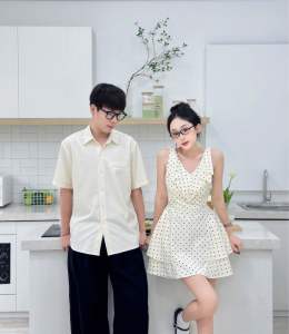Set đồ đôi sơmi nam màu kem phối váy nữ chấm bi cổ tim dáng xoè tay sát nách