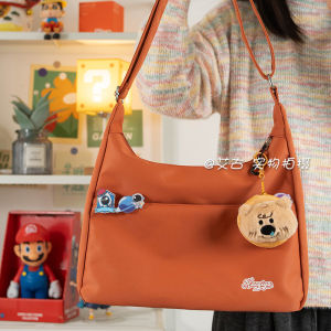 กระเป๋าสะพายข้างความจุขนาดใหญ่สีพื้นสุดเท่สำหรับนักเรียน กระเป๋าสะพายข้างแบบสะพายข้างสำหรับเด็กผู้หญิง อุปกรณ์การศึกษาที่หลากหลาย