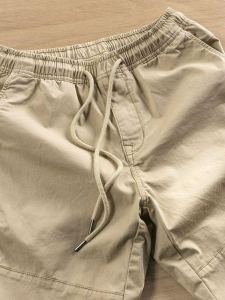 กางเกงลำลองชายฤดูใบไม้ผลิและฤดูใบไม้ร่วง กางเกงขายาวทรงหลวมแบบยืดหยุ่นเล็กๆ พร้อมเชือกผูก ทรงเข้ารูป กางเกงขายาวทำงาน สไตล์ลำลอง สำหรับผู้ชาย