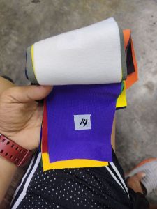Yonex 215 gsm fabric sold per roll in various colors including gray yellow brown orange purple blue and gray.