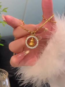 สร้อยคอน้ำเต้าปัดเกลียวแบบหมุนได้สำหรับผู้หญิงทองใหม่สไตล์จีนย้อนยุคอารมณ์ประณีตความรู้สึกสูงแหวนกลมจี้ทองทราย