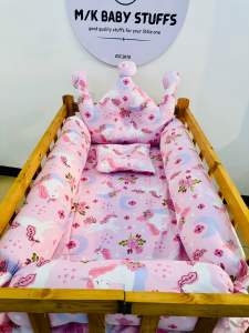 crib with big bolster bumper