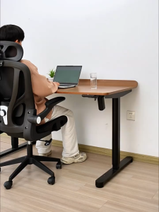 Ergonomic office chair with mesh backrest and adjustable headrest positioned at a white L-shaped desk in a well-organized home office setting.