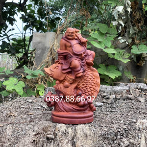 Tượng phật di lặc cưỡi cá cao 23cm chất liệu gỗ hương phun pu giả cổ