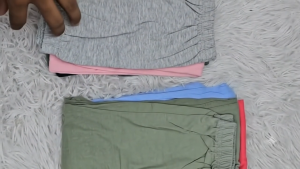 Kids pants in various colors including pink purple beige red orange blue black and green. Size 2-14. Suitable for casual wear.