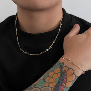 ชุดสร้อยคอและกำไลข้อมือรูปดาวสี่แฉกประดับเพชรเทียมสไตล์ฮิปฮอป ดีไซน์หรูหรา สำหรับผู้ชายและผู้หญิง สไตล์พังก์ สายคล้องไหปลาร้า