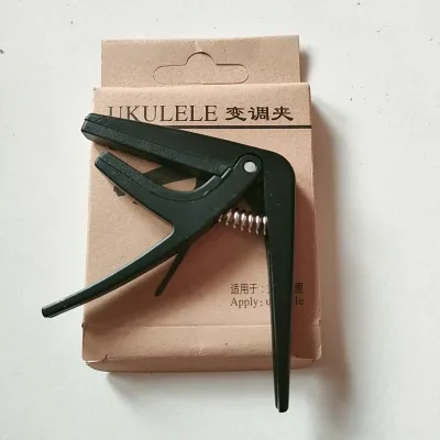 Capo gitar kentrung atau ukulele 4 senar